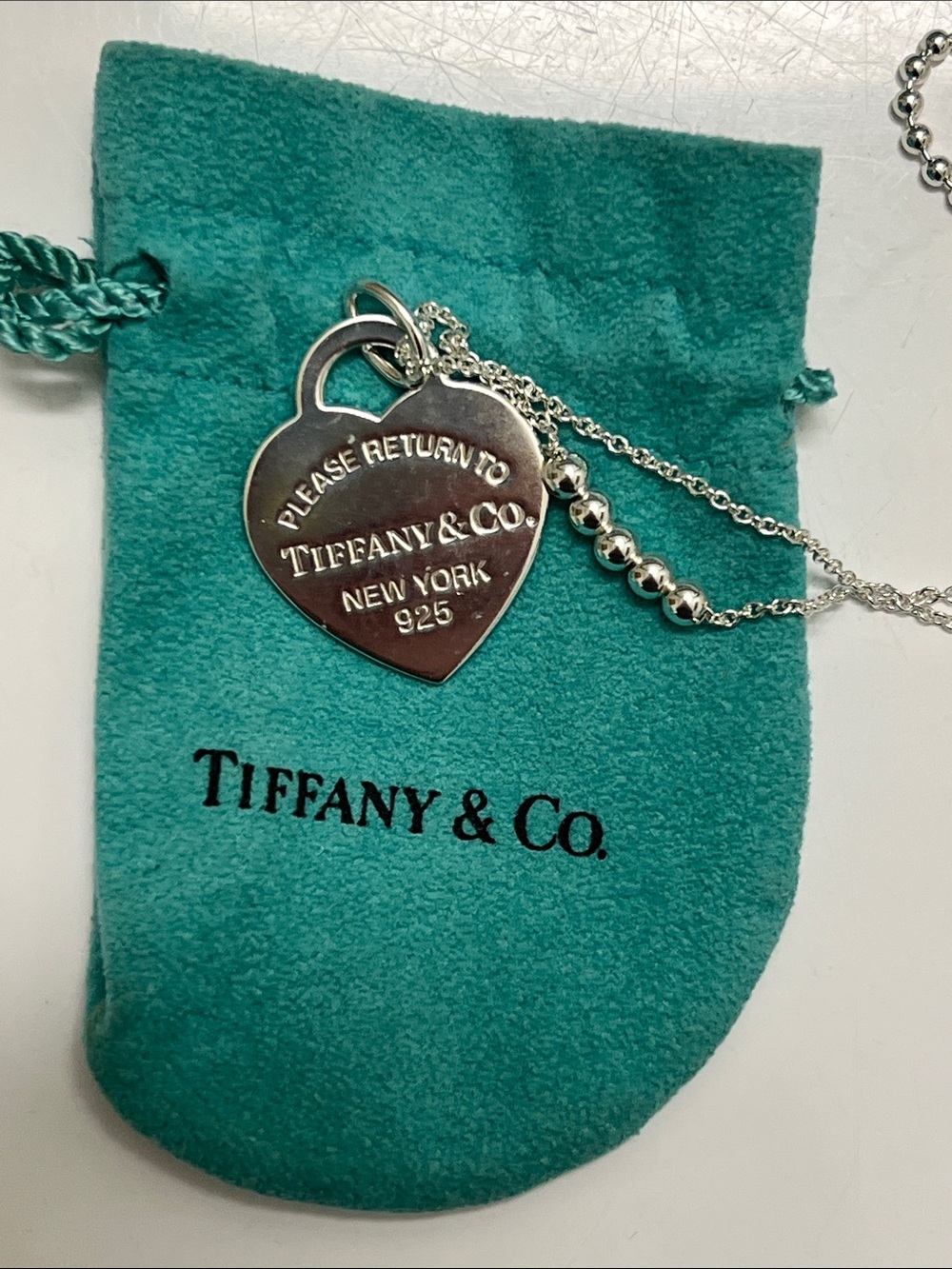 Tiffany & Co. Sterling Silver Heart Tag Necklace on Turquoise Pouch